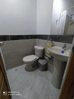 a bathroom with a toilet and a sink at cabañas Brisas y Perla by AMAUNA in Moñitos