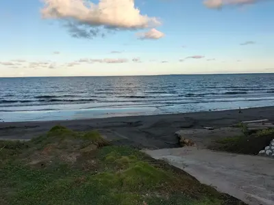 a view of the ocean from the beach at cabañas Brisas y Perla by AMAUNA in Moñitos