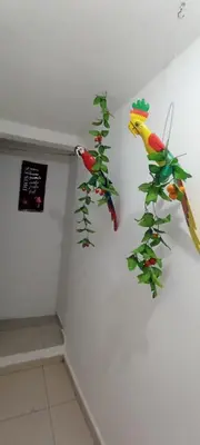a room with two parrots on the wall at Encantadora casa con ambiente guajiro #3 in Barranquilla