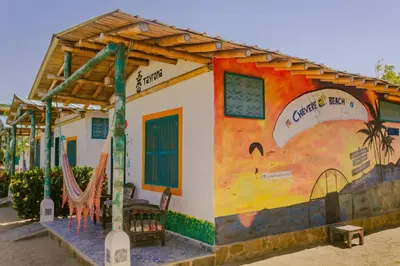 a house with a painting on the side of it at Eco-Hotel Chevere Beach in Puebloviejo