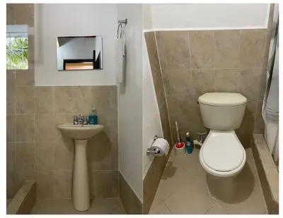 a bathroom with a toilet and a sink at Apartamentos Sol de Coveñas TI in Coveñas