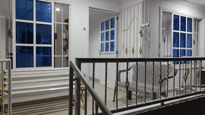 a balcony with white walls and windows and a railing at Apto los Almendros in Cartagena de Indias