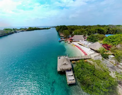 an aerial view of a beach with a pier and the water at Hotel Isla Lizamar in Isla Grande