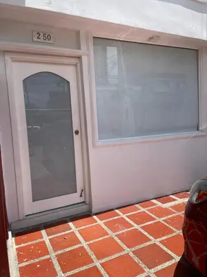 a front door of a garage with a large window at Alojamiento vacacional en Bocagrande Cartagena in Cartagena de Indias
