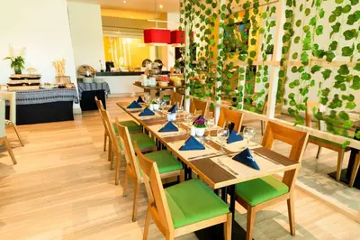 a dining room with a long table and chairs at Hilton Garden Inn Barranquilla in Barranquilla