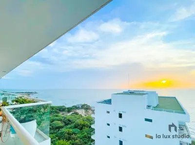 a view of the ocean from a building at Moderno 3 hab con la mejor Vista en playa dormida Santa Marta in Santa Marta