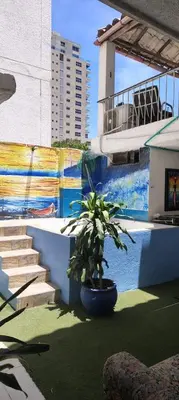 a potted plant sitting next to a swimming pool at Guacamayas in Santa Marta