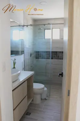 a bathroom with a toilet and a sink and a shower at 2BR Oceanfront Apartment - Direct Beach Access - Modern and Spacious - 6th Floor in Cartagena de Indias