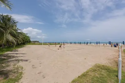 a group of people playing volleyball on a beach at Lujoso Apartamento Con Salida Directa A La Playa Edificio Morros Eco in Cartagena de Indias