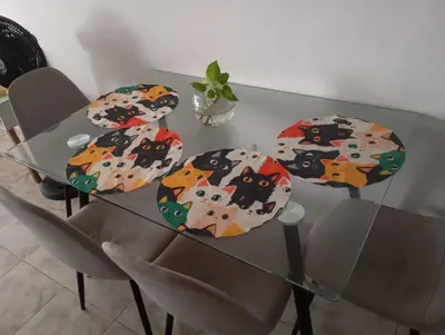 a glass dining table with four chairs with umbrellas at @casa_grace Bienvenidos! in Cartagena de Indias