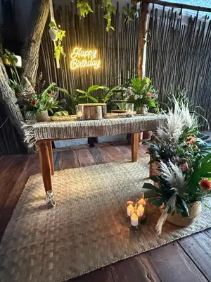 a bench with a bunch of potted plants on a patio at Thani Ecobeach Barú in Playa Blanca