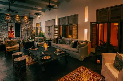 a living room with a couch and a table at Casa Belle Cartagena Hotel Boutique in Cartagena de Indias