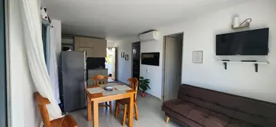 a living room with a couch and a table at Apartamento 201 Palmar de los vientos in San Bernardo del Viento