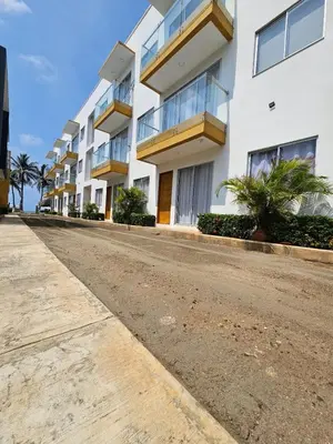 an empty street in front of a building at Apartamento 201 Palmar de los vientos in San Bernardo del Viento