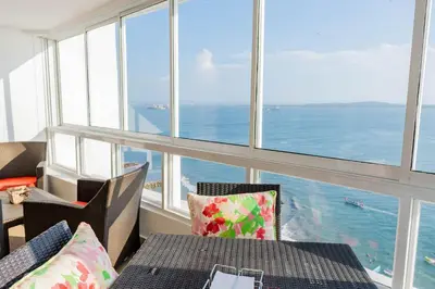 a dining room with a view of the ocean at U-GO Playa Mar en El Laguito con Vista al Mar in Cartagena de Indias