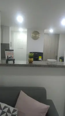a living room with a couch and a counter with a mirror at APARTAMENTO OCEAN DRIVE 410 CARTAGENA in Cartagena de Indias
