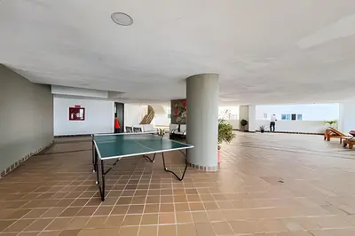 a room with a ping pong table in it at Apartamento 2 Dormitorios Laguito. Vista Mar in Cartagena de Indias