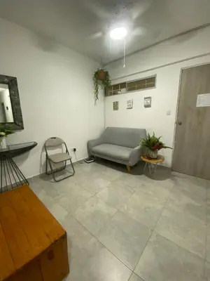 a living room with a couch and a table at Apto Boho in Cartagena de Indias