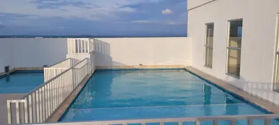 a swimming pool on the side of a building at Hermoso apartamento cerca a las playas de Marbella en Cartagena in Cartagena de Indias