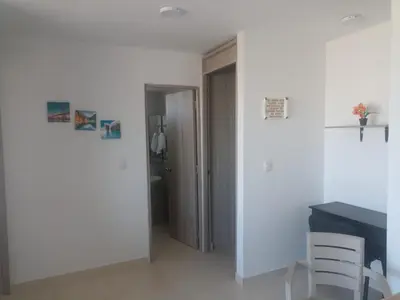a white room with a table and two chairs at apartamento1108 in Cartagena de Indias