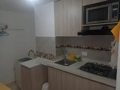 a small kitchen with a sink and a microwave at apartamento1108 in Cartagena de Indias