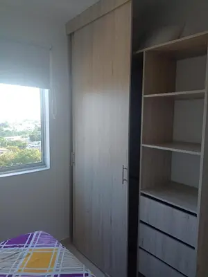 a bedroom with a closet and a bed and a window at apartamento1108 in Cartagena de Indias