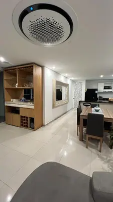 a living room with a table and a dining room at Cartagena Seaview Elegance in Cartagena de Indias
