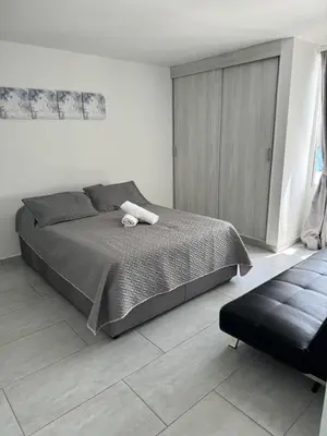 a bedroom with a bed with a white towel on it at Hermoso Apartamento vista al mar El Laguito in Cartagena de Indias