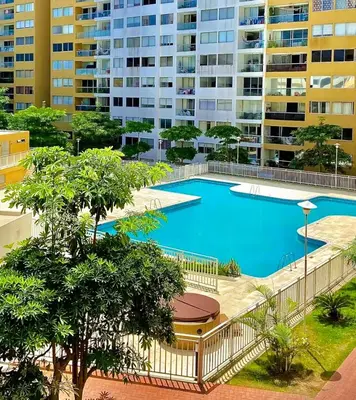 a large swimming pool in front of a building at Apartamentos Condominio Oporto - Cerca a Todo in Barranquilla