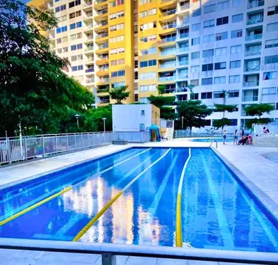 an empty swimming pool with buildings in the background at Apartamentos Condominio Oporto - Cerca a Todo in Barranquilla