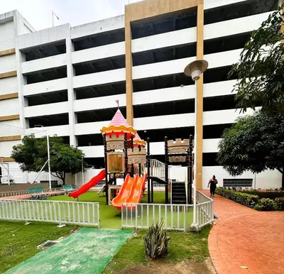 a playground with a slide in front of a building at Apartamentos Condominio Oporto - Cerca a Todo in Barranquilla
