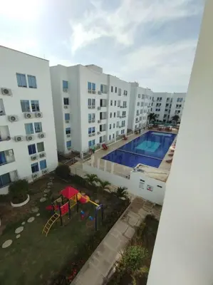 an overhead view of a large apartment building with a pool at Hospedaje y Alojamiento Familiar in Coveñas