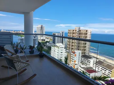 a balcony with a view of the ocean and buildings at Apartamento con vista al mar y al centro de Cartagena in Cartagena de Indias