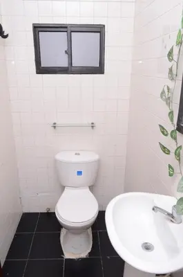 a bathroom with a toilet and a sink at CASA ZOÉ in Cartagena de Indias