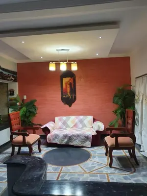 a living room with a couch and two chairs at CASA ZOÉ in Cartagena de Indias