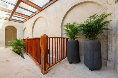 a room with two potted plants on the wall at Cinco Quintas Hotel Boutique in Cartagena de Indias