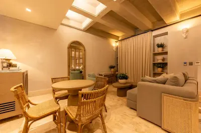 a living room with a couch and a table and chairs at Cinco Quintas Hotel Boutique in Cartagena de Indias