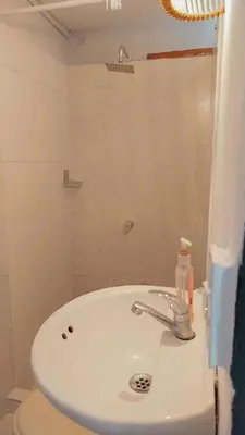 a bathroom with a sink and a toilet at Hb4 Double Room with Private Bathroom and Balcony in Cartagena de Indias
