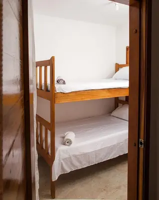 a couple of bunk beds in a room at Hb1 Triple Room With Air Conditioning And WIFI in Cartagena de Indias