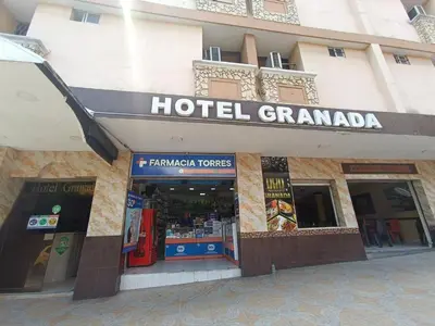 a hotel granada sign on the side of a building at Hotel Granada Inn in Barranquilla
