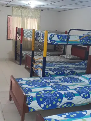 a group of three bunk beds in a room at Hotel Granada Inn in Barranquilla