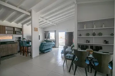 a living room with a couch and a table and chairs at Casa Bita Morales CASA 201 in Cartagena de Indias