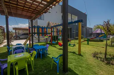 a playground with tables and chairs in a yard at Casa Bita Morales CASA 201 in Cartagena de Indias