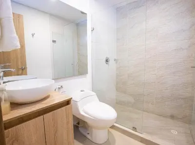 a bathroom with a toilet and a sink and a shower at Acogedor Marbella ideal familias mínimo 2 días in Cartagena de Indias