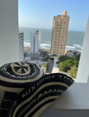 a tire sitting on the ledge of a balcony at Acogedor Marbella ideal familias mínimo 2 días in Cartagena de Indias