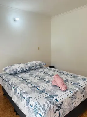 a pink pillow sitting on top of a bed at Cartagena Kings Hostel in Cartagena de Indias