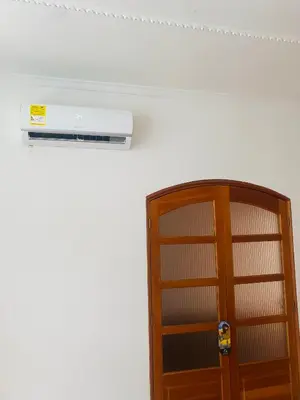 a room with a book shelf next to a door at Cartagena Kings Hostel in Cartagena de Indias