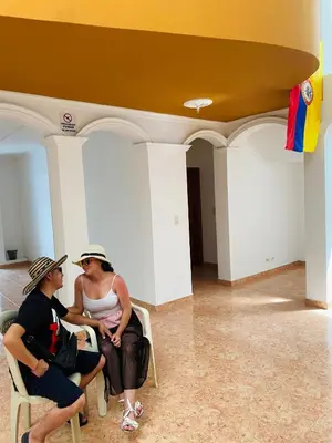 two women sitting in chairs in a room at Cartagena Kings Hostel in Cartagena de Indias