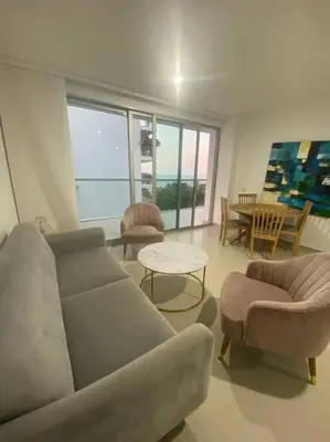 a living room with a couch and chairs and a table at Apartamento completo vacacional in Cartagena de Indias
