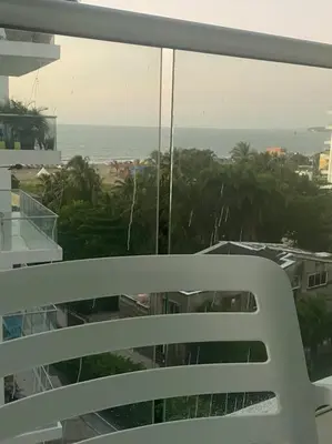 a view of the ocean from a balcony of a building at Apartamento completo vacacional in Cartagena de Indias